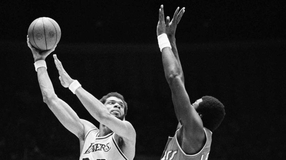 Los Angeles Lakers' Kareem Abdul-Jabbar hooks a shot over Portland Trail Blazers' Jim Brewer