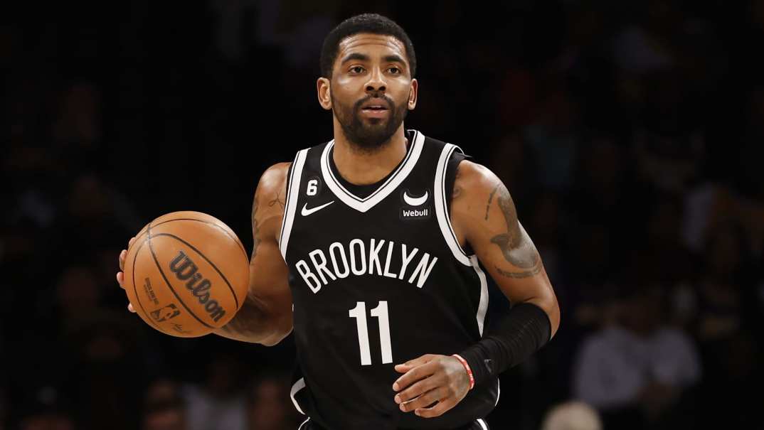 Kyrie Irving of the Brooklyn Nets with a basketball