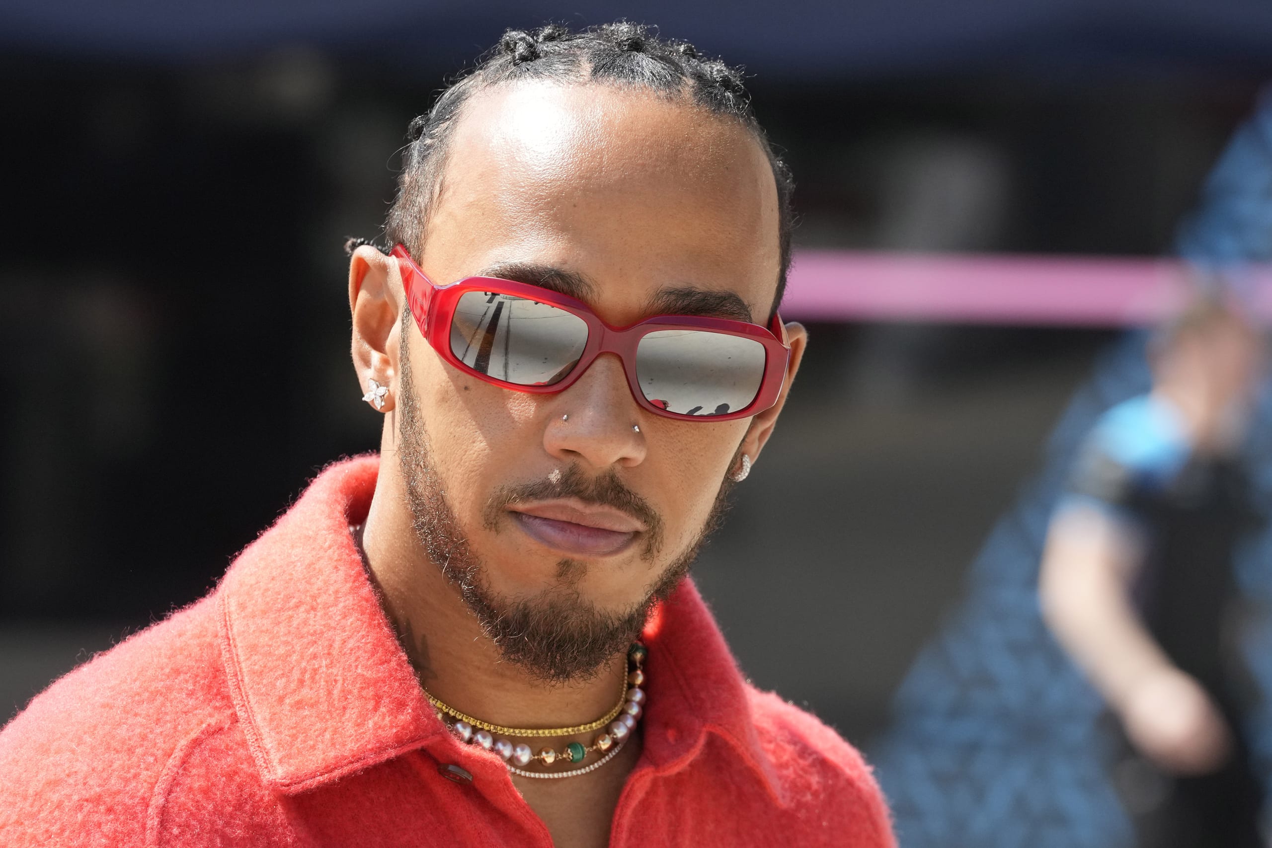 F1 racer Lewis Hamilton undergoes jewelry inspection, addresses nose ring query, gets cleared to race