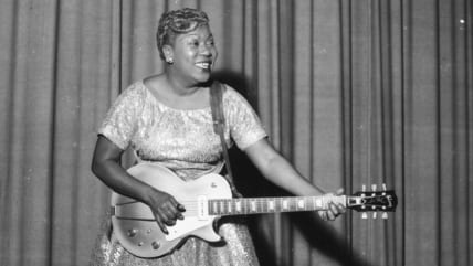 American singer Sister Rosetta Tharpe performing on stage with her guitar and Chris Barber