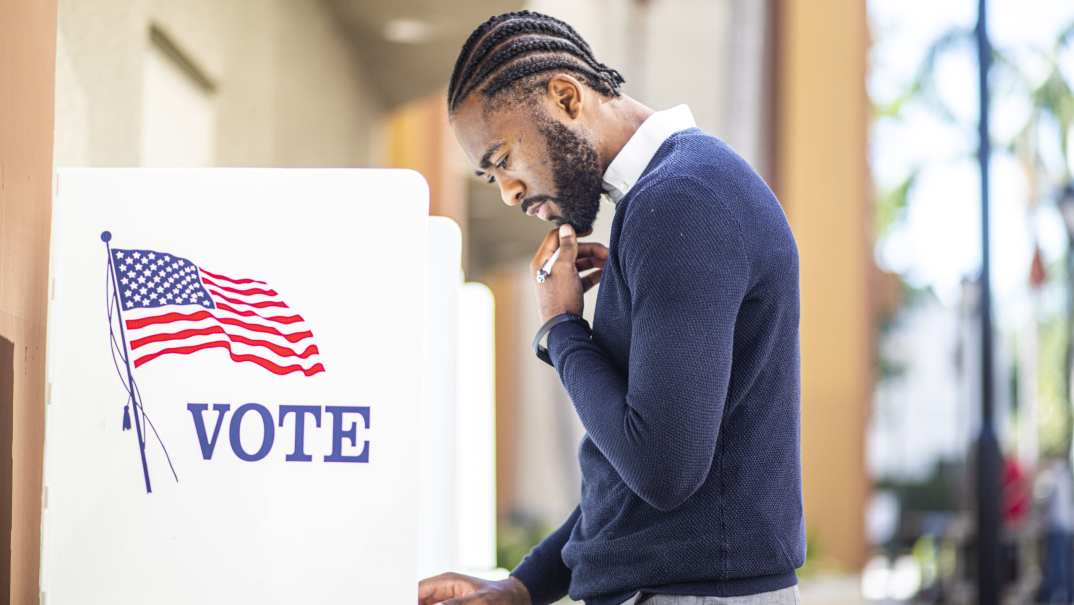 Black man voting, theGrio.com