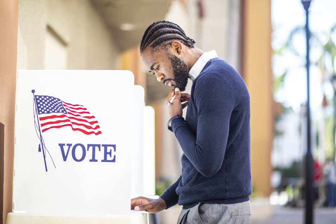 Black man voting, theGrio.com