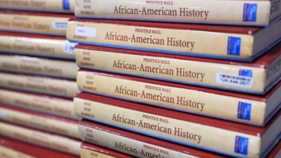 Stacks of textbooks on "African-American History"