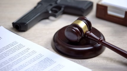 gavel and handgun, theGrio.com