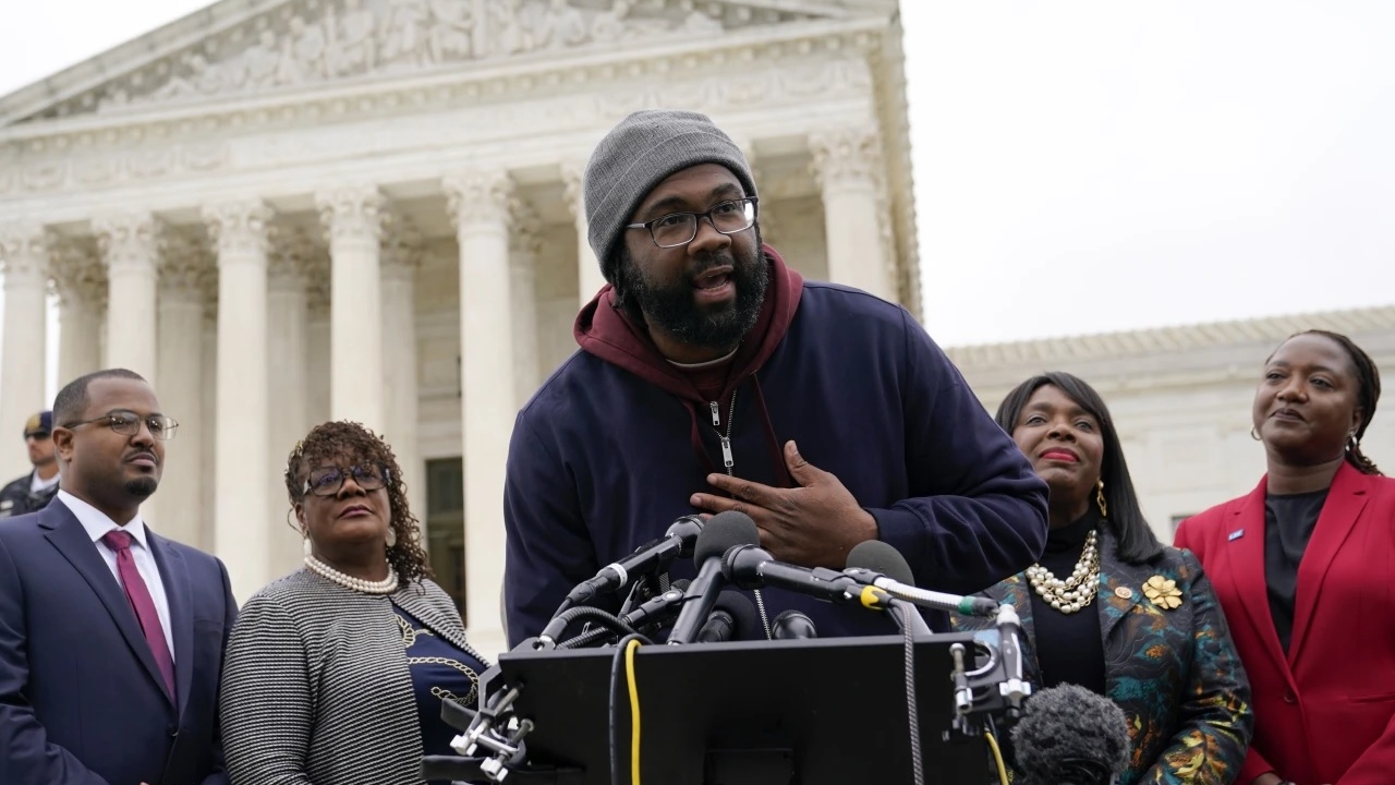 Evan Milligan (center), plaintiff in Merrill v. Milligan, an Alabama redistricting case