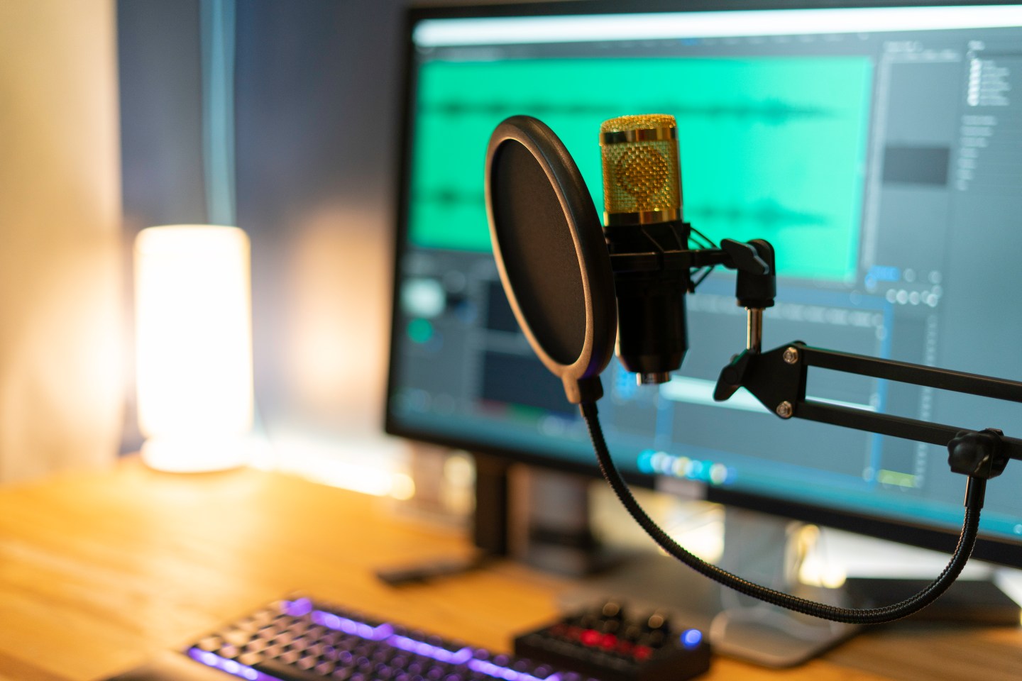 A microphone in front of a computer screen