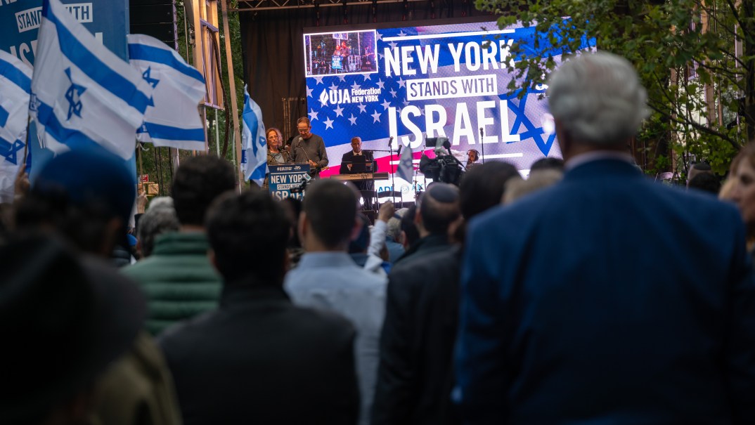 A crowd of people at a 'New York Stands With Israel' vigil and rally