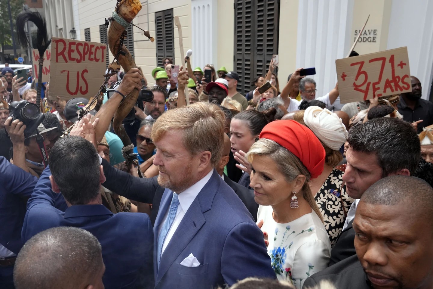 Dutch king and queen are confronted by angry protesters on visit to a slavery museum in South Africa