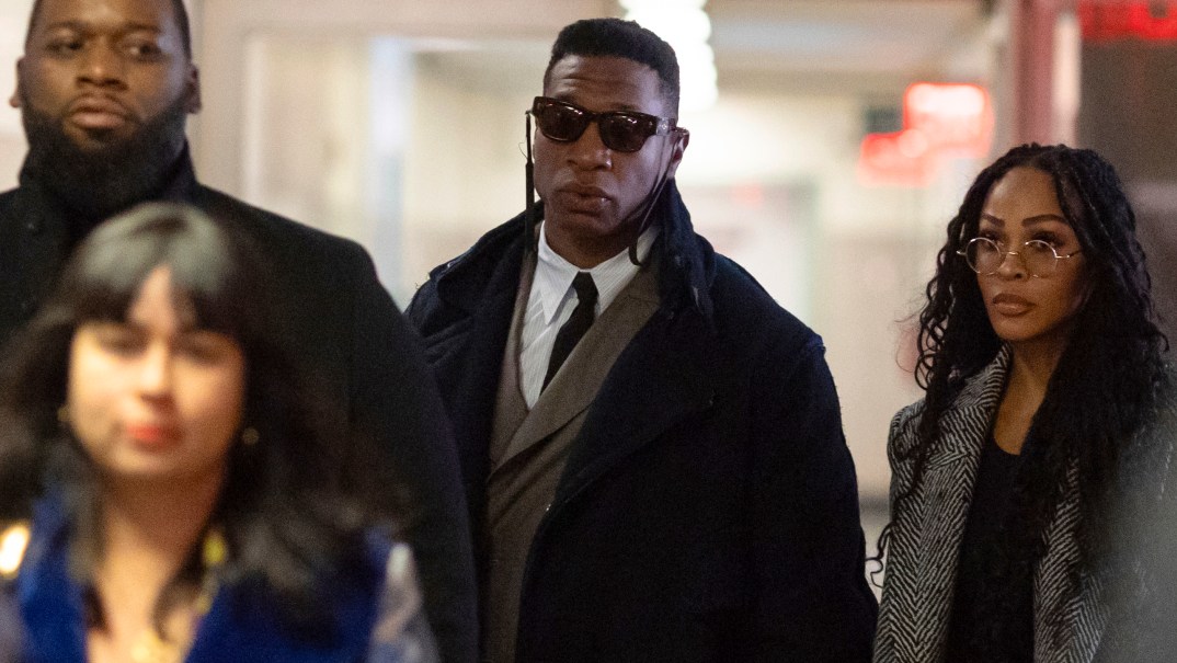 Actors Jonathan Majors, center, and Meagan Good