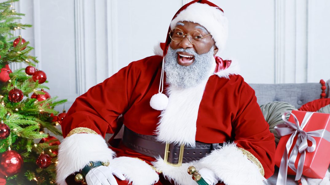 Black Santa, The Black Santa Houston, Black Santa Claus performer, professional Black Santa, Black Christmas characters, Black Christmas family pajamas, 25 Days of Holiday, Magan Butler-Coleman, Kelvin Douglas, theGrio.com