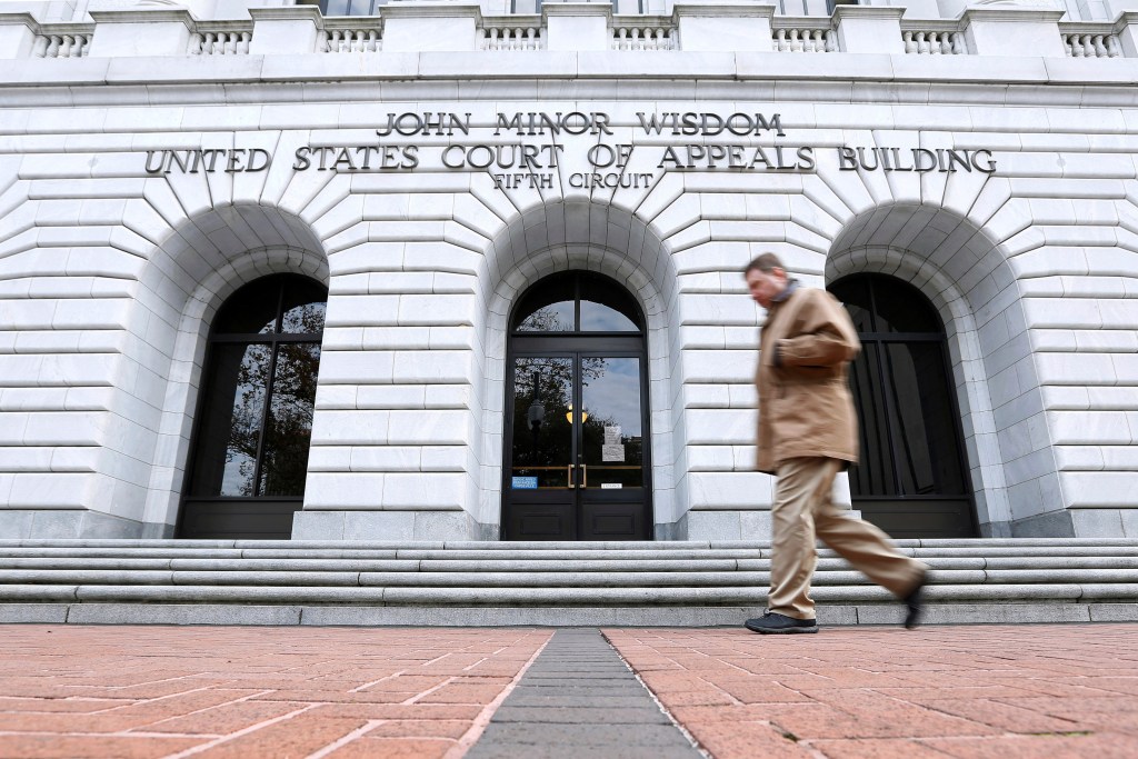 A man walks in front of the 5th U.S. Circuit Court of Appeals