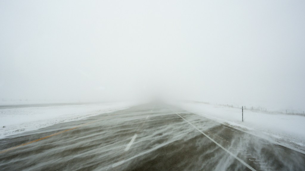 A snowy US Highway 20 during a blizzard near Galva, Iowa