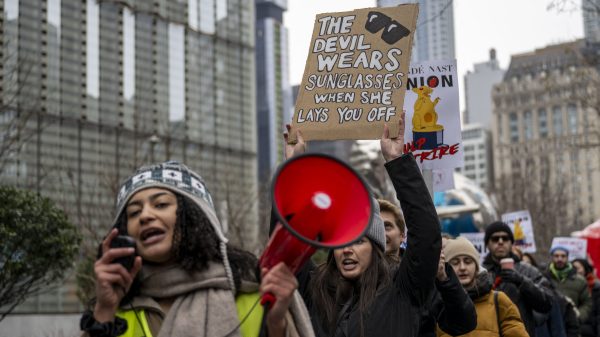 Condé Nast employees roll out the red carpet for a one-day strike against labor practices