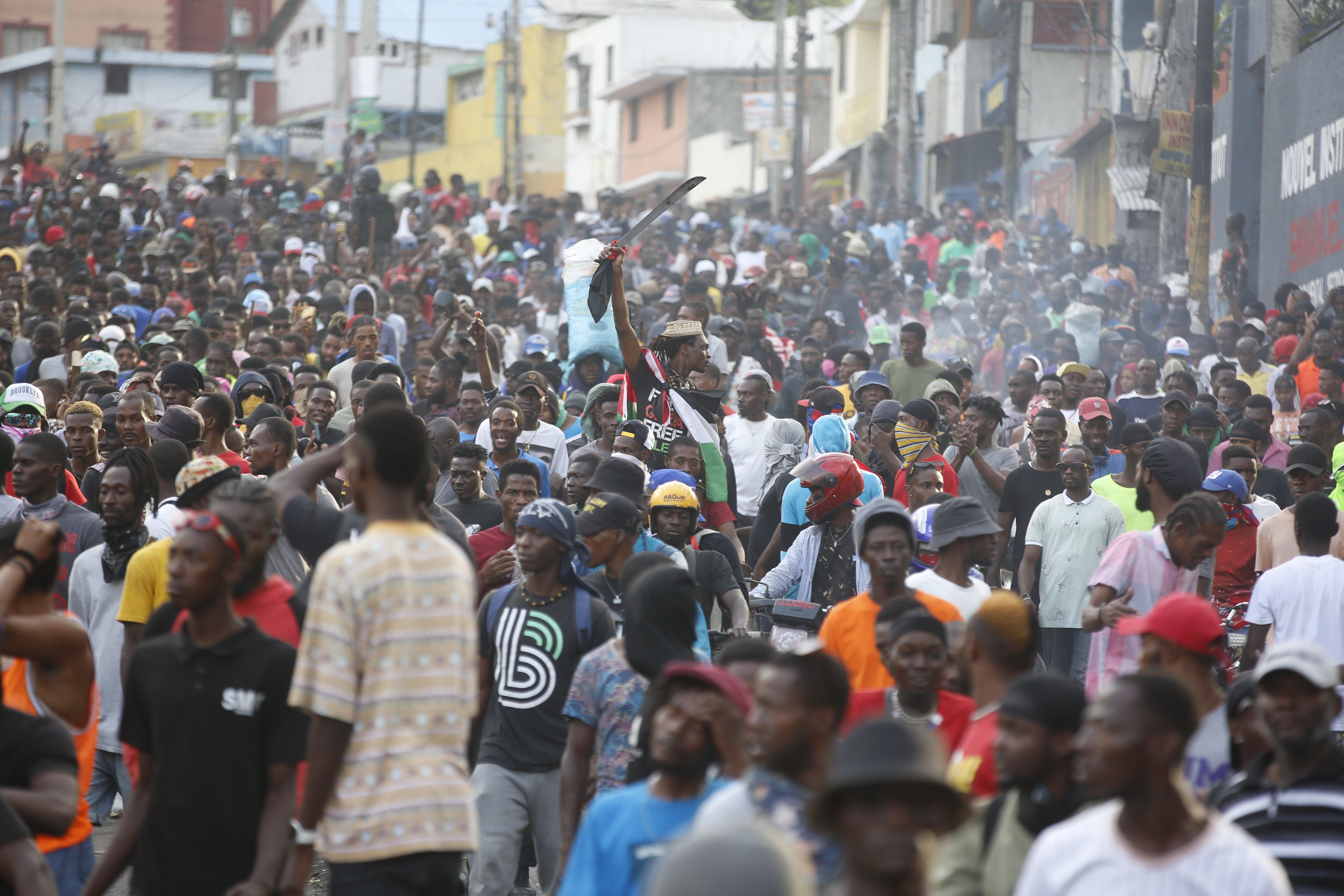 Former rebel leader arrives in Haiti’s capital as protests against prime minister gain momentum