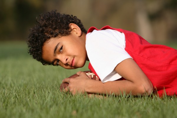 Black, white, Hispanic parents view benefits of youth tackle football differently, poll finds