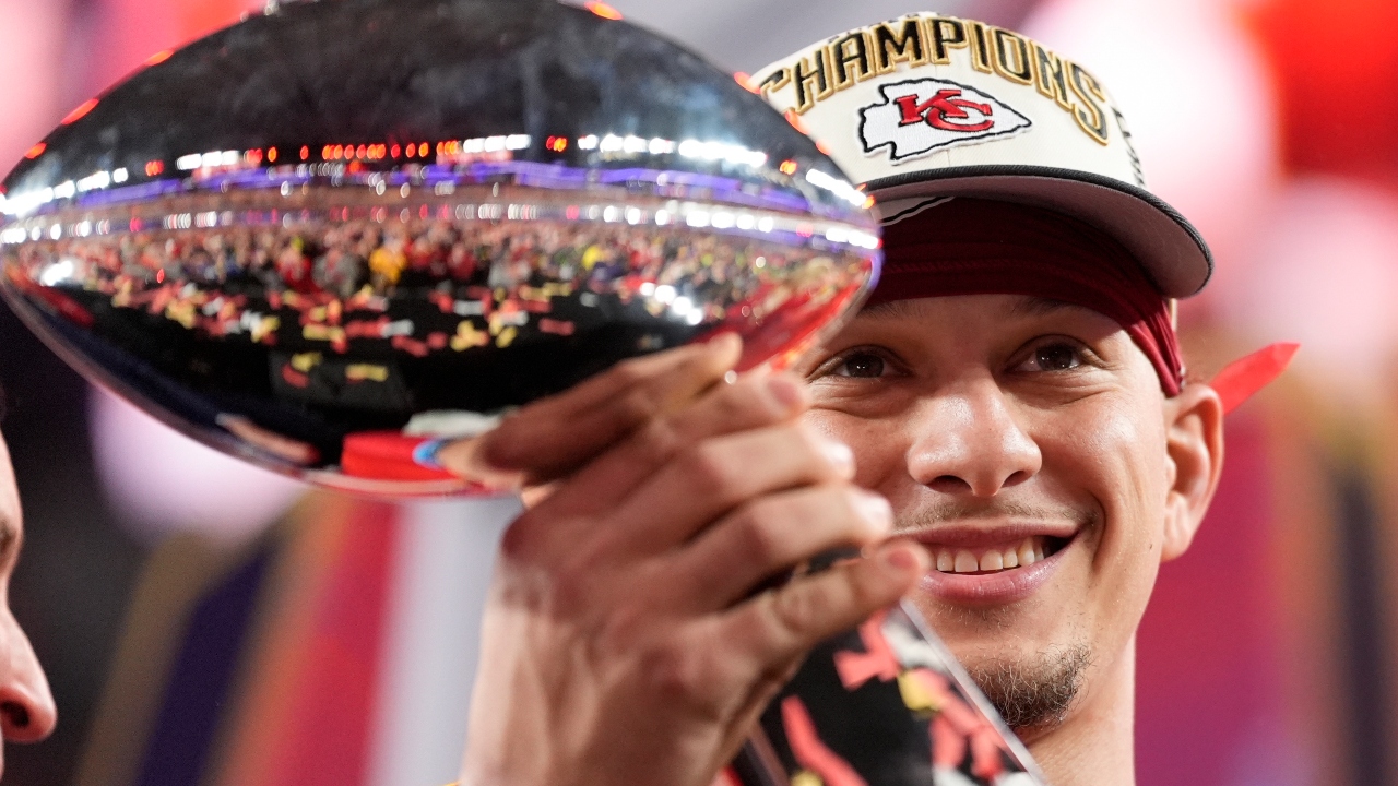 Kansas City Chiefs quarterback Patrick Mahomes holds the Vince Lombardi Trophy