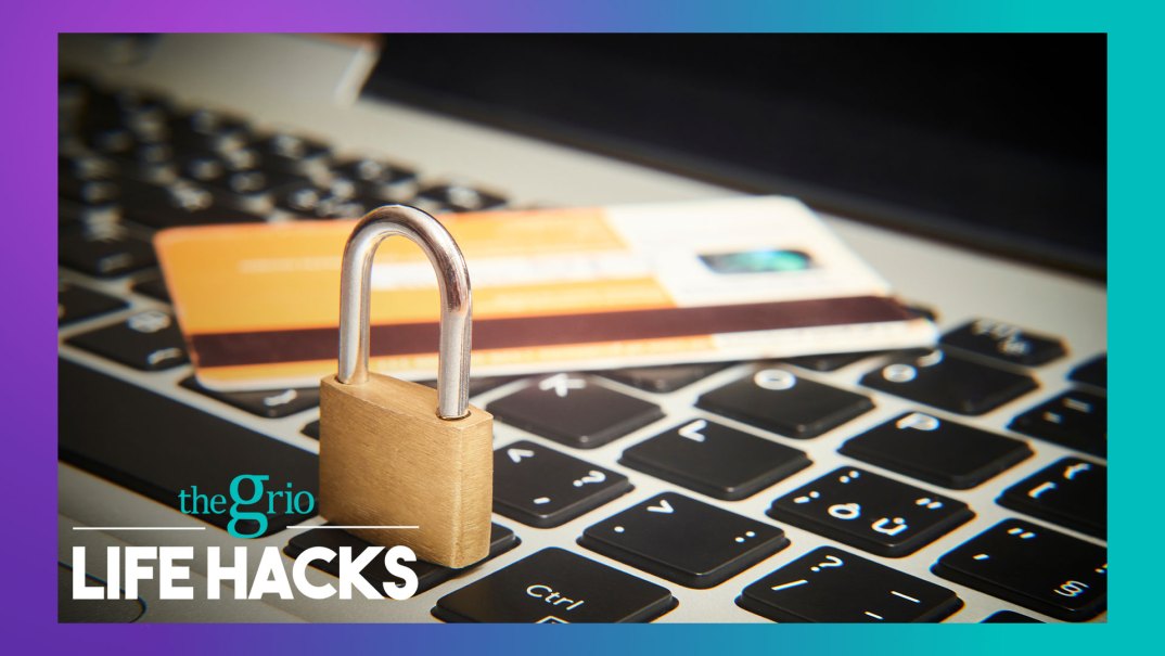 A keyboard with a credit card and lock on it