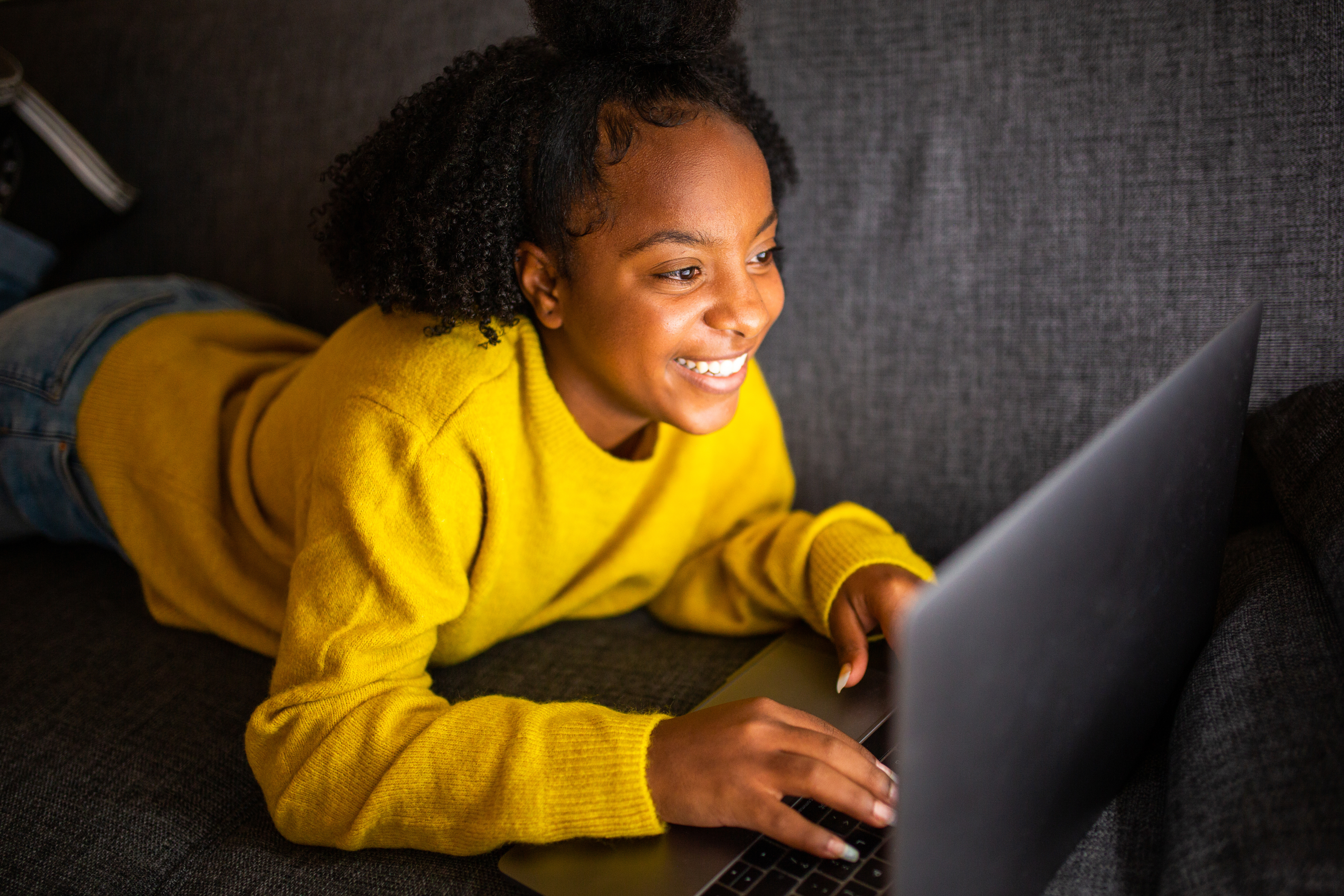 A girl works on a laptop