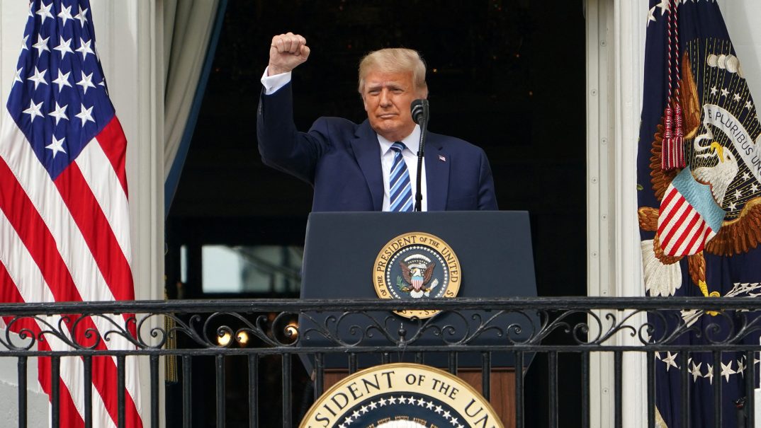 Former President Donald Trump raises a fist