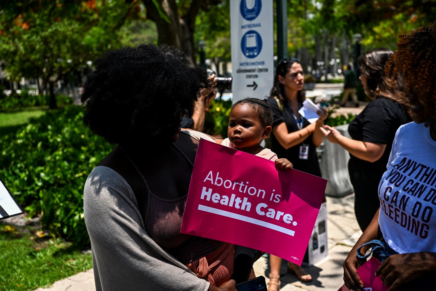 Tifanny Burks holds Novah Smith at an abortion rights protest