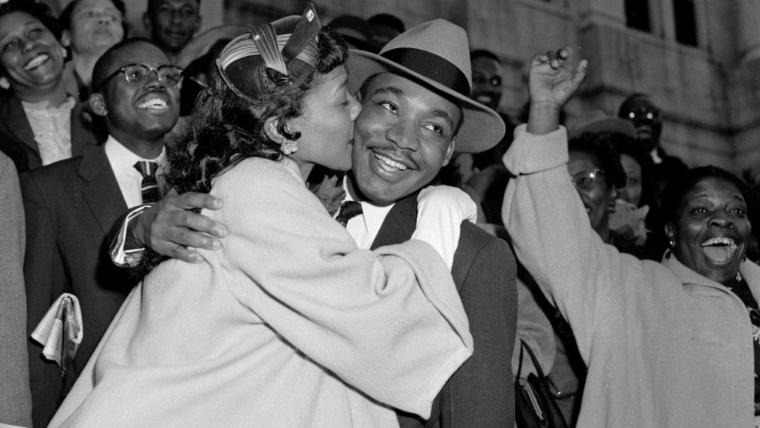 Coretta Scott King greets her husband, the Rev. Martin Luther King Jr., with a kiss