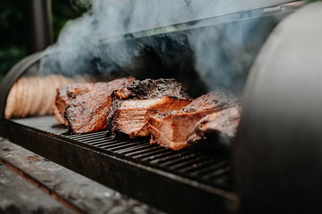 Outdoor smokers, smoked meats, cookout season, charcoal smokers, pellet smokers, propane smokers, electric smokers, what type of outdoor smoker is best, how to smoke meat, theGrio.com