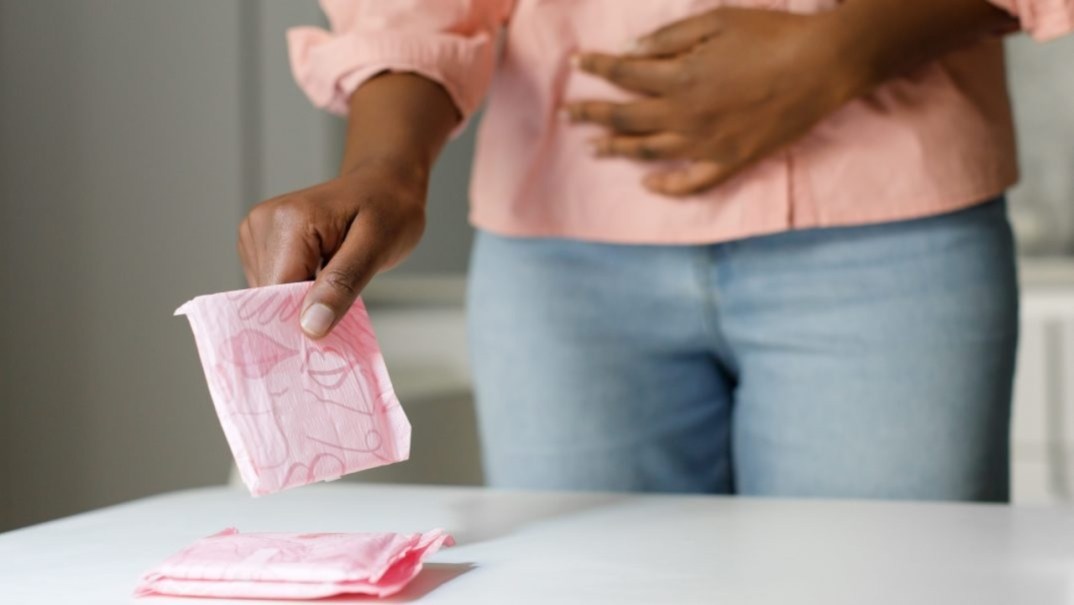 Woman holding menstrual pad