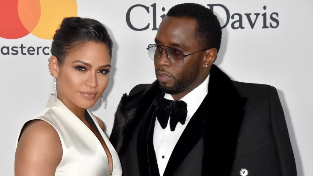 Singer Casandra “Cassie” Ventura wearing white with Sean "Diddy" Combs, wearing a black tuxedo