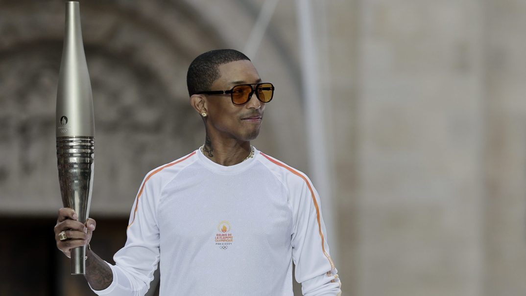 Olympics, Black stars at the Olympics, Paris Olympics 2024, 2024 Paris Olympics, celebrities Paris Olympics, what celebrities are at the Paris Olympics?, Snoop Dogg Olympics, Pharell Williams Olympics, who were the Olympic torch bearers? theGrio.com