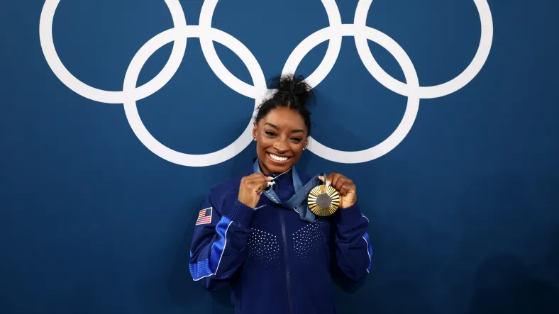 Simone Biles gold medal, Simone Biles olympics, How many times has Simone Biles won the all-around?, Is Simone Biles the greatest of all time?, Simone Biles greatest of all time, Simone biles mental health, Simone Biles GOAT, Simone Biles G.O.A.T, Why does Simone Biles need therapy?, Simone Biles therapy, Simone Biles 2024 Olympics theGrio.com