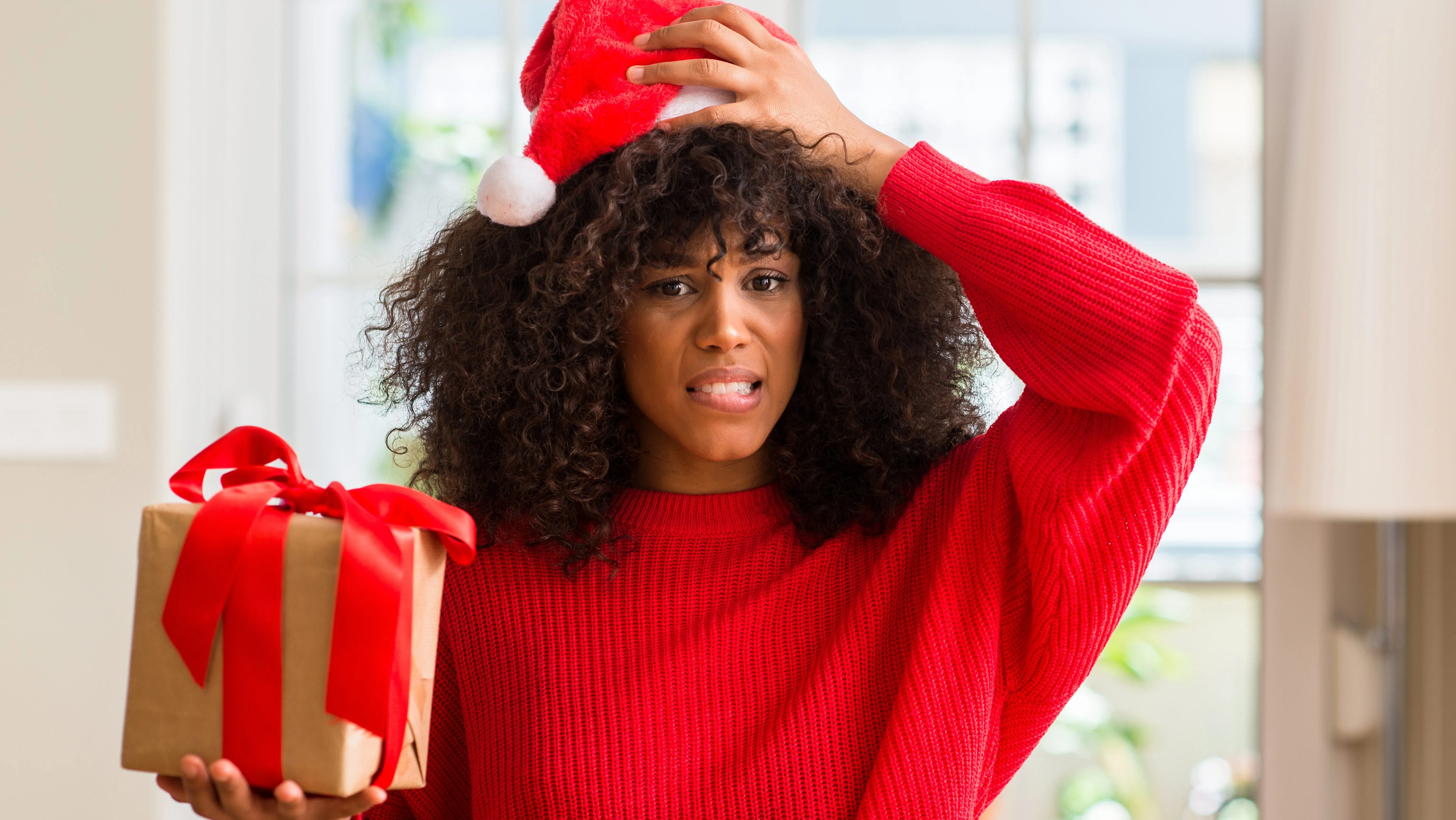 holiday gifts, bad holiday gifts, resting gift face, how to respond to a bad gift, theGrio.com