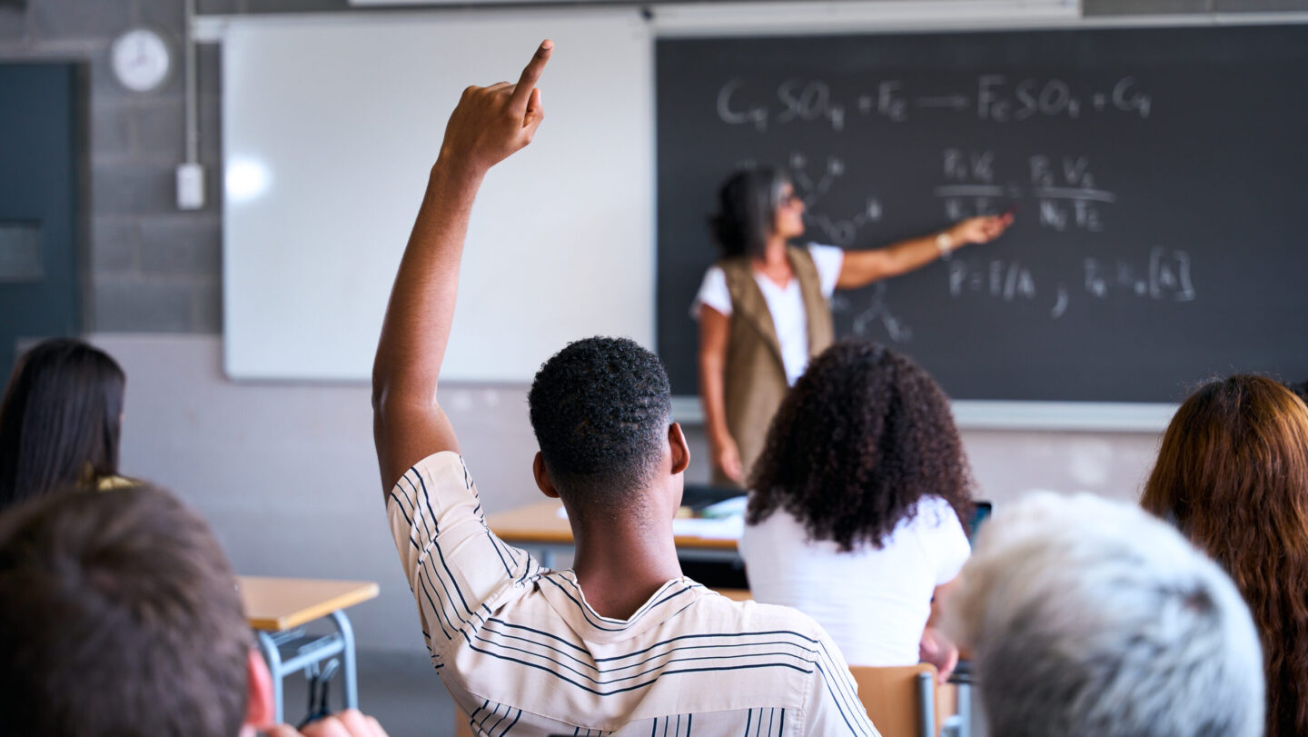 Young group of gen z students attending class at high school. Young black student boy asking Lubbock-Cooper, racism in school, Trump Administration, Department of Education’s Office for Civil Rights, Texas, Black students, theGrio.com
