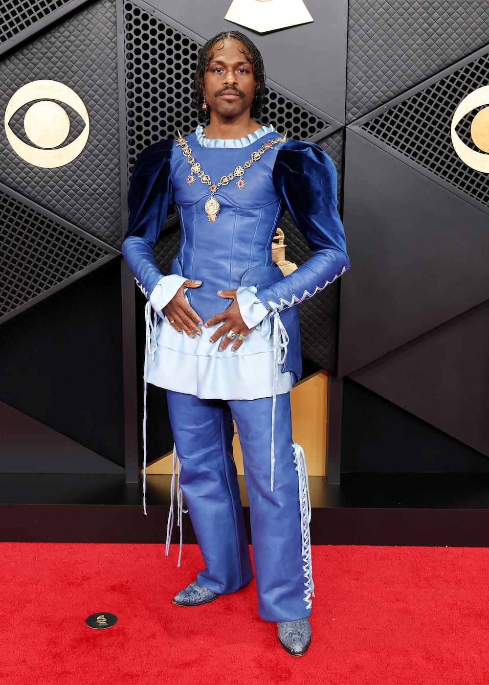 Duckwrth attends the 68th Grammy Awards in a blue leather renaissance suit