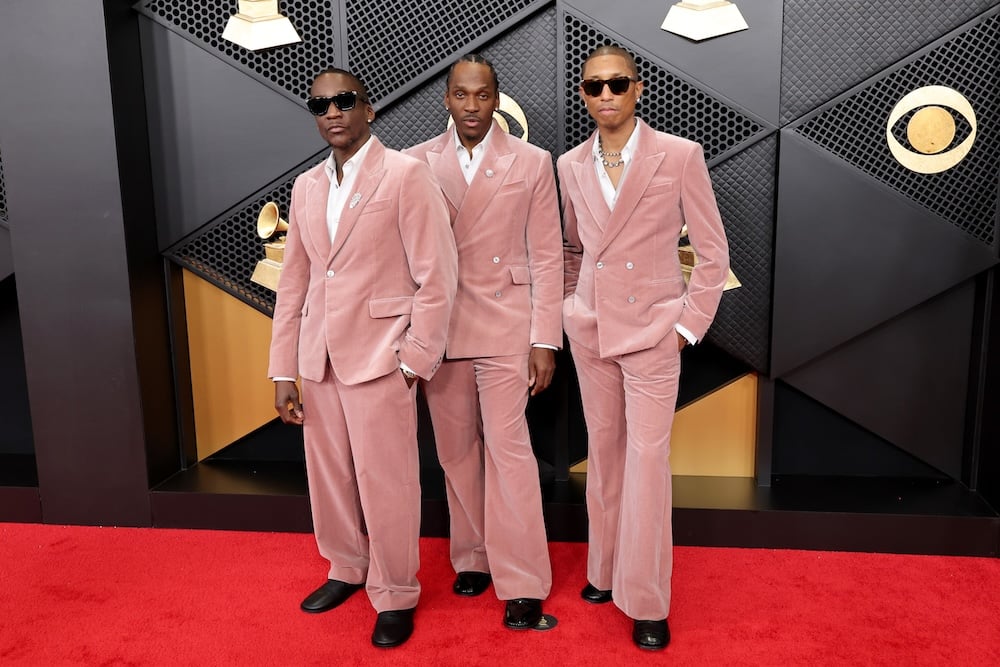 Malice and Pusha T of Clipse and Pharrell Williams attend the 68th Grammy Awards in matching blush colored Louis Vuitton suits