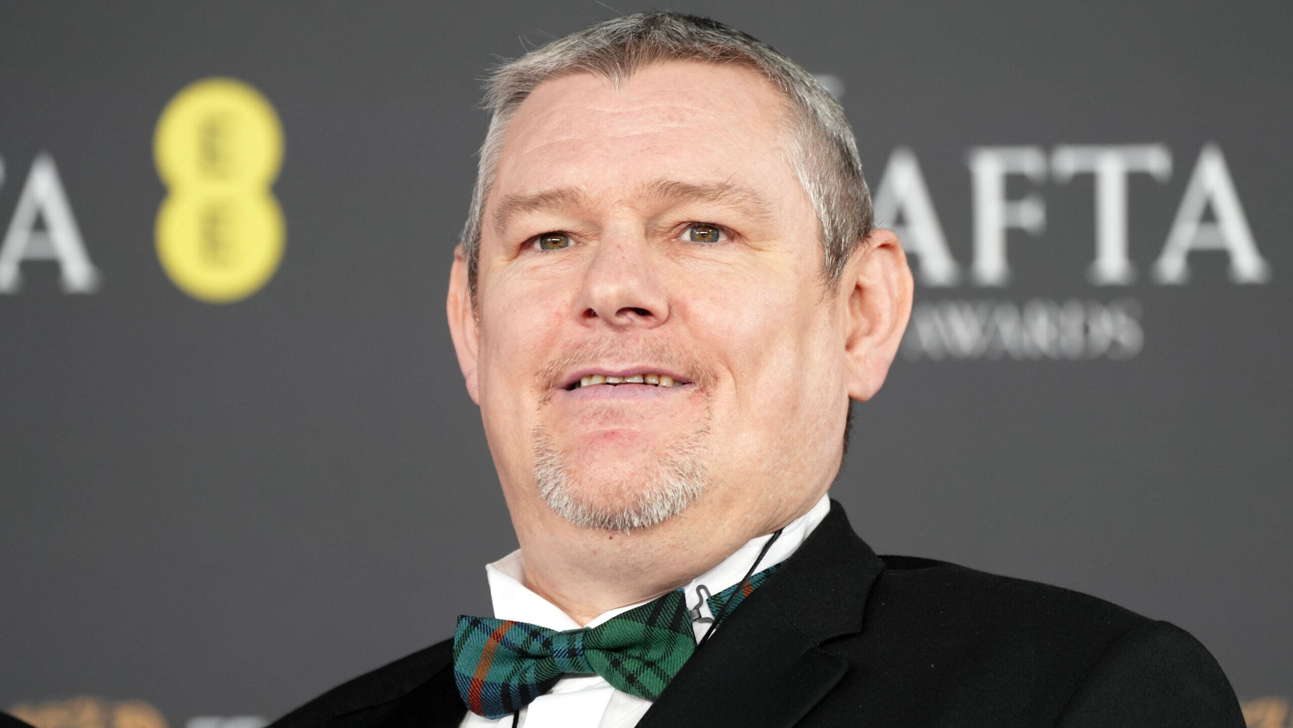 John Davidson, who vocalized the N-word during the BAFTAs, is asking why he was seated by a microphone